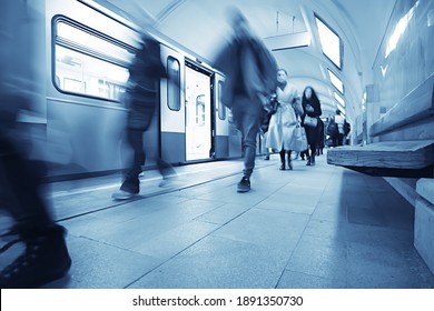 crowd of people metro in motion blurred, abstract background urban traffic people