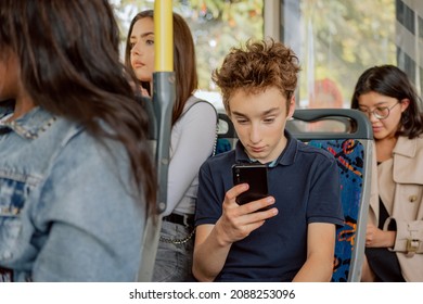 Crowd Of People On Bus Squeeze Afternoon In City Traffic Jams Young Women Sitting In Public Transport Coming Back From College Work Boy Coming Back From School Holding Phone In Hand Watching Videos