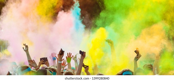 Crowd Of People On Color Run Throwing Colored Powder. Happy Holi Theme.