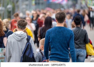 Crowd of people on the street. Summer day. No recognizable faces - Shutterstock ID 1899143971