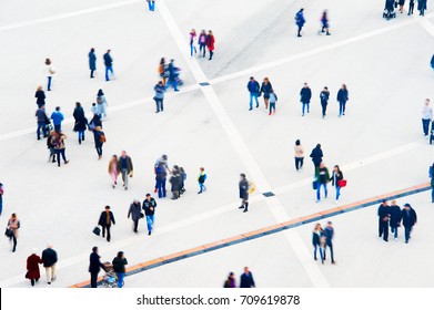 Crowd Of People At A Public Square. Long Exposure. Motion Blur. Aerial View