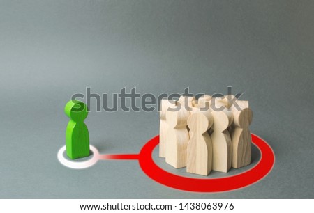 A crowd of people representing the majority influence a stranger. Rejected from society, lonely. Society imposes its own rules and regulations, the eradication of dissent and distinctive qualities.