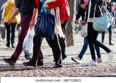 Crowd Of People With Shopping Bags On The Move In The City