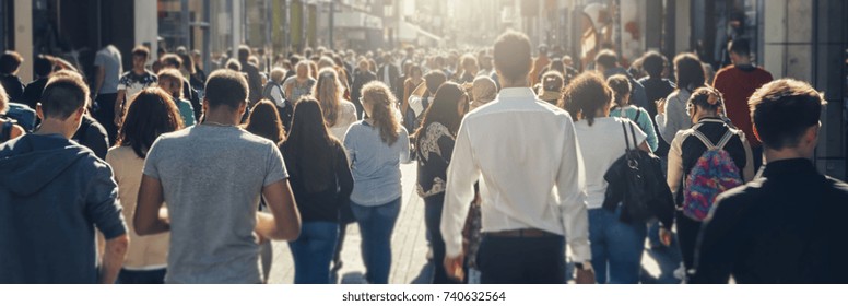 crowd of people in a shopping street - Shutterstock ID 740632564