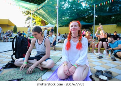 Crowd Of People Sitting On Karemats At The Open Air Cinema Theater Listening To The Huru Preaching. Vedalife Fest. July 10, 2021. Kyiv, Ukraine