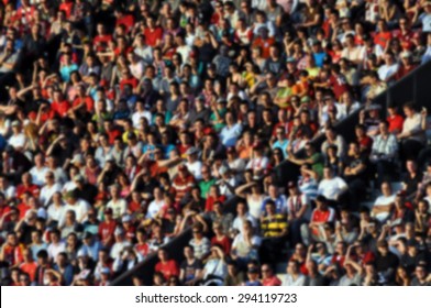 Crowd Of People In A Stadium - Blurred Image