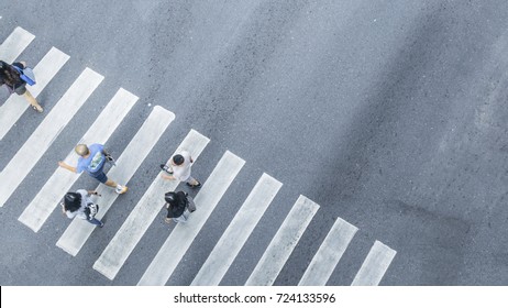 Crowd Of People Walk On Street Pedestrian Crossroad In The City Street ,from Top View ,bird Eye View.