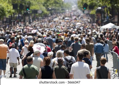 Crowd Of People Walking On The Street Shallow Depth Of Field