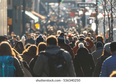 Crowd of people walking on a street in New York City 