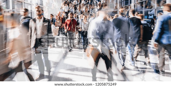 Crowd of people\
walking on a street in\
london