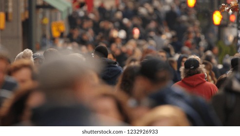 Crowd of people walking street