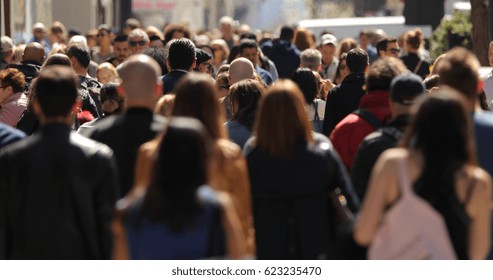 Crowd of people walking street