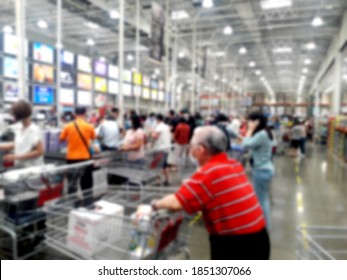 Crowd In Shopping Mall, Queuing At The Checkout Counter To Check Out.backdrop And Design Element Use. Defocused Background With Bokeh Light.