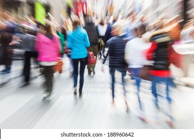 Crowd Of Shopping People In The Busy Street Of The City With Creative Zoom Effect