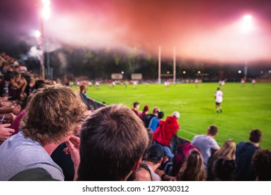 Crowd Of Spectators On Stadium At A Sporting Event. American Football, Rugby Game. Super Bowl