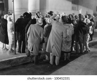 Crowd In Street Looking Up