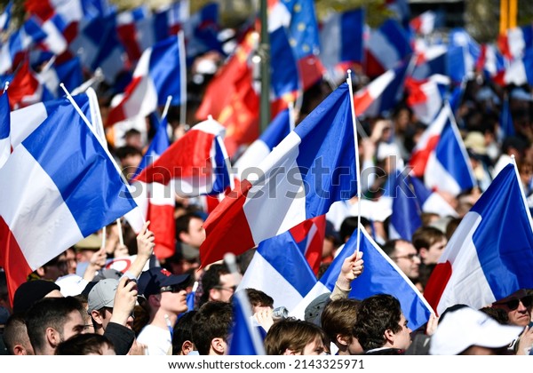 The\
crowd and supporters with french flags during the campaign meeting\
(rally) of French presidential candidate Eric Zemmour, on the\
Trocadero square in Paris, France on March 27,\
2022.