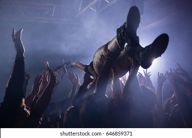 Crowd Surfing At A Concert In Nightclub