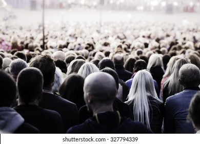 Crowd Of Unrecognisable People. Slow Shutter Speed Motion Blur For Unrecognizability.