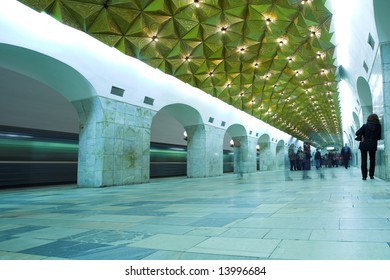 crowd waiting train on platform in subway