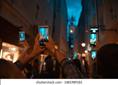 crowd watch with interest the performance on the street - Shutterstock ID 1481989181