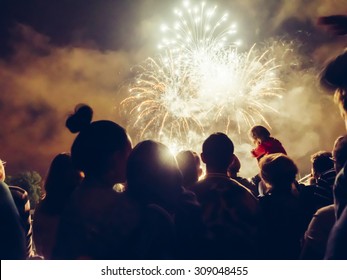 Crowd watching fireworks and celebrating - Shutterstock ID 309048455