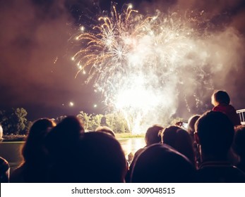 Crowd watching fireworks and celebrating - Shutterstock ID 309048515