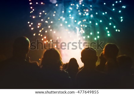 Crowd watching fireworks and celebrating