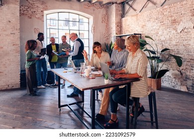 crowd working together developing new ideas and strategies - Shutterstock ID 2231092579