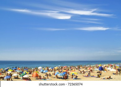 Crowded Atlantic summer beach in Carcavelos, Portugal - Powered by Shutterstock