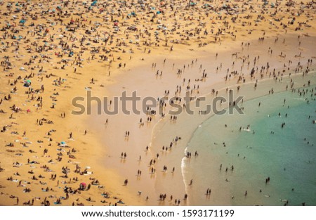 Similar – Aerial View From Flying Drone Of People Crowd Relaxing On Algarve Beach In Portugal