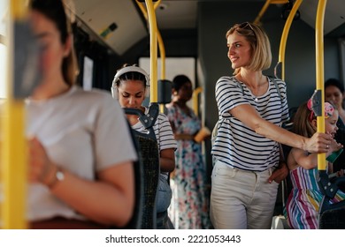 A Crowded City Bus Is Crowded With Commuters