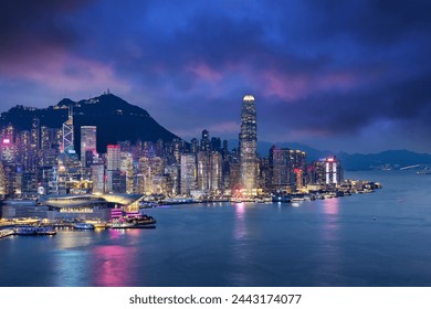 Crowded downtown and building in Hongkong Island during sunset in blue hour color mood - Powered by Shutterstock