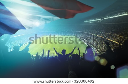 crowded football stadium with french flag