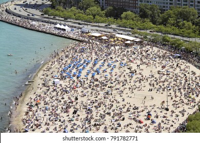 Crowded Oak Street Beach In Summer Beside Lake Shore Drive In Chicago, IL. USA