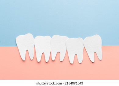 Crowding Tooth Cartoon Made From Paper. Problems Resulting From Dental Crowding Include Gum Disease, Trouble Chewing, Toothache Or Jaw Pain.