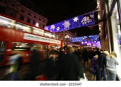 Crowds Doing Their Festive Shopping At A Very Busy Oxford Circus, Central London, Showing Movement Blur.