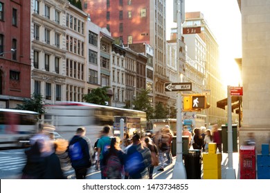 Crowds Of People In Motion Walking Down The Busy Sidewalk On 5th Avenue In Midtown Manhattan, New York City NYC