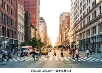 Crowds of people walking through a busy crosswalk at the intersection of 23rd Street and Fifth Avenue in Midtown Manhattan, New York City NYC - Shutterstock ID 1834135933