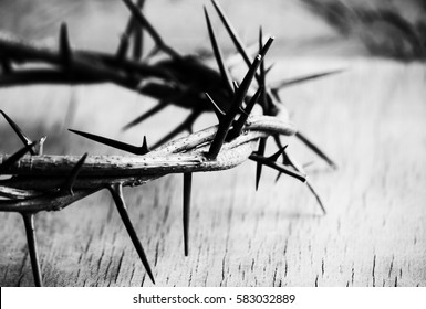 Crown of thorns on wood desk. Christian concept