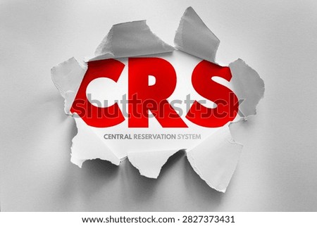 CRS Central Reservation System text revealed through torn paper background, conceptual business and technology design showing booking management, travel systems, digital infrastructure and enterprise solutions
