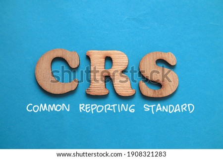 CRS Common Reporting Standard, text words typography written on blue background, life and business motivational inspirational concept