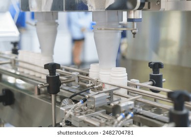 crucial part of automated production lines in various industries consistent filling of bottles - Powered by Shutterstock