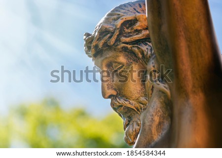 Crucifix Jesus Christ with a thorn wreath on the head. Sunbeams. (faith, self-sacrifice concept)
