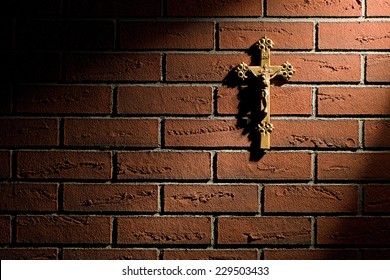 Crucifix With Jesus On Brick Wall