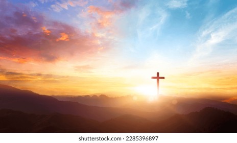 The crucifix symbol of Jesus on the mountain sunset sky background - Shutterstock ID 2285396897