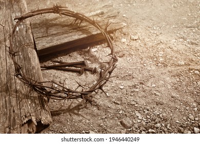 Crucifixion Of Jesus Christ. Cross With three Nails And Crown Of Thorns on ground.