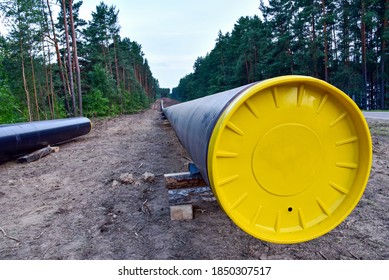 Crude Oil And Natural Gas Pipeline Construction Work In Forest Area.  Installation The Petrochemical Pipe. Construction The Pipeline For Transport Gas To LNG Plant