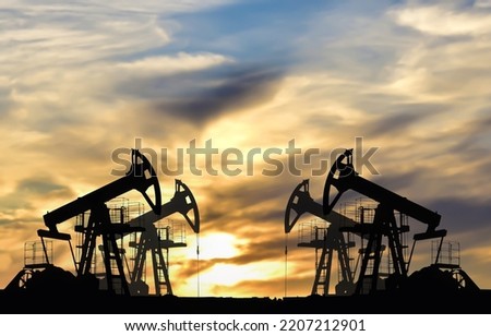 Crude oil Pumpjack on sunset. Fossil crude output and fuels oil production. Oil drill rig and drilling derrick. Global crude oil Prices, energy, petroleum demand (OPEC+). Pump jack at oilfield.
