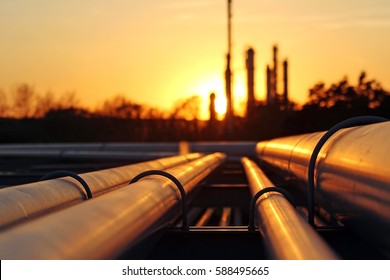 Crude Oil Refinery During Sunset With Pipeline Connection